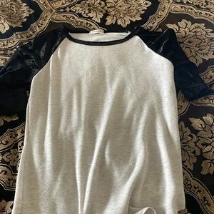 Cream colored style shirt with black velvet sleeves